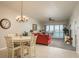 Cozy dining area adjacent to the living room, offering a comfortable space for enjoying meals with water views at 530 S Gulfview Blvd # 303, Clearwater, FL 33767