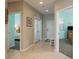 Hallway with tile flooring leading to bedrooms, all featuring light blue paint and neutral carpeting at 530 S Gulfview Blvd # 303, Clearwater, FL 33767
