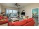 Cozy living room with comfortable seating, ceiling fan, and balcony access with stunning water views at 530 S Gulfview Blvd # 303, Clearwater, FL 33767