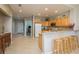 Open floor plan with kitchen featuring barstool seating, flowing into the dining area and living spaces at 530 S Gulfview Blvd # 303, Clearwater, FL 33767