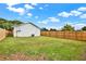 Expansive backyard with lush green grass and a privacy fence, perfect for outdoor activities at 5400 9Th N Ave, St Petersburg, FL 33710