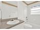 Bright bathroom featuring a granite vanity, a toilet, and a shower-tub combo at 5400 9Th N Ave, St Petersburg, FL 33710