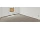 Bright bedroom featuring neutral carpet, a window, and a minimalist design at 5400 9Th N Ave, St Petersburg, FL 33710