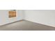 Bright bedroom with neutral carpet, a window, and a minimalist aesthetic, awaiting personal touches at 5400 9Th N Ave, St Petersburg, FL 33710