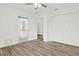 Tiled bedroom with a ceiling fan, ensuite bathroom, and closet space at 5400 9Th N Ave, St Petersburg, FL 33710