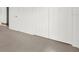 A bedroom with light gray carpet and multiple white closet doors offering ample storage space at 5400 9Th N Ave, St Petersburg, FL 33710
