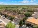 Townhome community aerial view showcasing well-spaced residences and mature tree coverage at 5717 Kingletsound Pl, Lithia, FL 33547
