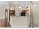 Eat-in kitchen with bar seating, granite countertop, and pendant lights at 5717 Kingletsound Pl, Lithia, FL 33547