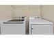 Bright laundry room featuring a modern Samsung washer and dryer and wire rack shelving at 5717 Kingletsound Pl, Lithia, FL 33547