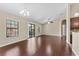 Bright living room featuring hardwood floors, a ceiling fan, and sliding glass doors to the outside at 5717 Kingletsound Pl, Lithia, FL 33547
