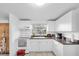 Efficient kitchen with white cabinetry and modern appliances, offering a clean and functional cooking space at 5875 92Nd N Ave, Pinellas Park, FL 33782