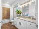 Bathroom showcasing a white vanity with a marble countertop and a shower with tile surround at 6 Academy S Way # 23A, St Petersburg, FL 33711