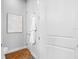 Bright restroom with tile floors, crisp white doors, and an elegant art piece at 6 Academy S Way # 23A, St Petersburg, FL 33711