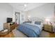 Bedroom featuring a ceiling fan, television and en-suite bathroom at 6 Academy S Way # 23A, St Petersburg, FL 33711