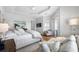 Sunlit bedroom featuring a flat screen television, a sitting area and an outdoor patio at 6 Academy S Way # 23A, St Petersburg, FL 33711