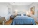 Bedroom with a tufted headboard, bright natural light, and cozy decor at 6 Academy S Way # 23A, St Petersburg, FL 33711