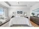 Bright bedroom featuring a tray ceiling, a comfortable couch and stylish decor at 6 Academy S Way # 23A, St Petersburg, FL 33711