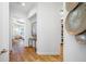 Bright hallway leading to the bedroom and closet space with wood floors at 6 Academy S Way # 23A, St Petersburg, FL 33711