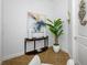 Bright hallway featuring a table, vases, and art at 6 Academy S Way # 23A, St Petersburg, FL 33711