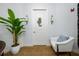 Bright hallway featuring a decorative door, accent lighting, and a comfortable chair at 6 Academy S Way # 23A, St Petersburg, FL 33711