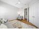 Comfortable living room with a cozy armchair, stylish rug, and ample natural light at 6 Academy S Way # 23A, St Petersburg, FL 33711