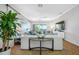 Spacious living room featuring elegant neutral furniture, tile floors, and bright natural light at 6 Academy S Way # 23A, St Petersburg, FL 33711