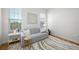 Inviting living room featuring a comfortable sofa, decorative pillows, and abundant natural light at 6 Academy S Way # 23A, St Petersburg, FL 33711