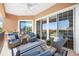 Inviting covered patio offers a cozy seating area with stylish outdoor furniture and bright accents at 6 Academy S Way # 23A, St Petersburg, FL 33711
