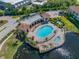 Aerial view of the luxurious community pool area with ample seating and a tranquil waterfront setting at 6 Academy S Way # 23A, St Petersburg, FL 33711