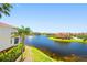 Scenic waterfront view showcasing lush landscaping and the community's well-maintained properties at 6 Academy S Way # 23A, St Petersburg, FL 33711