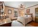 A charming bedroom features a ceiling fan, area rug, and a bed at 646 16Th Ne Ave, St Petersburg, FL 33704
