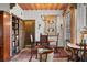 Elegant dining room showcases dark wood furniture, tapestry wall hanging, and stained glass windows at 646 16Th Ne Ave, St Petersburg, FL 33704