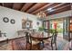 Charming dining room featuring dark wood furniture, chandelier lighting, and access to the outdoors at 646 16Th Ne Ave, St Petersburg, FL 33704