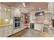 Modern kitchen with custom cabinets, granite countertops, stainless steel appliances, and a cozy window seat at 646 16Th Ne Ave, St Petersburg, FL 33704