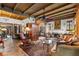 Spacious living room boasting a fireplace, beamed ceilings, and a beautiful antique rug at 646 16Th Ne Ave, St Petersburg, FL 33704