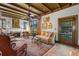 Elegant living room with beamed ceilings, a fireplace, and lots of natural light at 646 16Th Ne Ave, St Petersburg, FL 33704