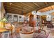 Spacious living room offers beautiful decor, wood beam ceiling, and access to dining area at 646 16Th Ne Ave, St Petersburg, FL 33704