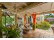 Covered patio area with ceiling fan and comfortable seating, ideal for outdoor entertaining at 646 16Th Ne Ave, St Petersburg, FL 33704