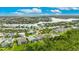 Waterfront property in a beautiful, gated community near a large lake with lush trees at 706 Manns Harbor Dr, Apollo Beach, FL 33572