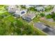 Aerial view of the property and neighborhood, including a view of the pond at 706 Manns Harbor Dr, Apollo Beach, FL 33572