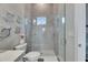Modern bathroom featuring tiled shower, glass door, and decorative accents at 706 Manns Harbor Dr, Apollo Beach, FL 33572