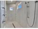 Modern glass shower with sleek fixtures, rain shower head, and tiled walls at 706 Manns Harbor Dr, Apollo Beach, FL 33572