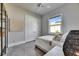 Bright bedroom with large window, white bedding, and stylish decor at 706 Manns Harbor Dr, Apollo Beach, FL 33572