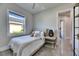Comfortable bedroom with a window view and neutral decor at 706 Manns Harbor Dr, Apollo Beach, FL 33572