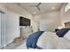 Spacious bedroom with TV, dresser and a serene atmosphere, seamlessly blending style and comfort at 706 Manns Harbor Dr, Apollo Beach, FL 33572