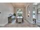 Bright dining room with tall ceilings, large window, and modern chandelier for elegant dining at 706 Manns Harbor Dr, Apollo Beach, FL 33572