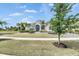 Charming home with manicured lawn, lush landscaping, and inviting curb appeal on a sunny day at 706 Manns Harbor Dr, Apollo Beach, FL 33572