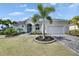 Charming single-Gathering home with a two-car garage, lush landscaping, and a well-maintained front yard at 706 Manns Harbor Dr, Apollo Beach, FL 33572