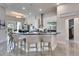 Modern kitchen with a spacious island and bar seating, perfect for casual dining and entertaining guests at 706 Manns Harbor Dr, Apollo Beach, FL 33572