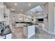 Well-lit kitchen with modern amenities and island seating for a cozy and functional cooking space at 706 Manns Harbor Dr, Apollo Beach, FL 33572